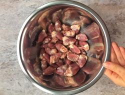 Chicken hearts in sour cream sauce in a slow cooker